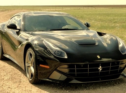 Black Ferrari on Dirt Roadwww.DiscoverLavish.com